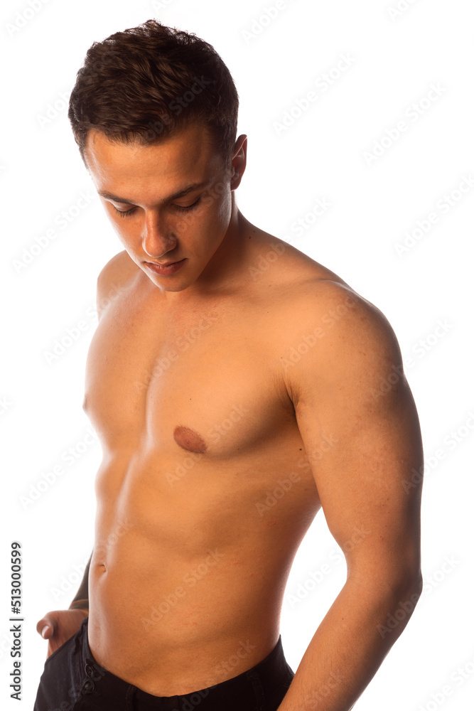 Muscular man standing over white background