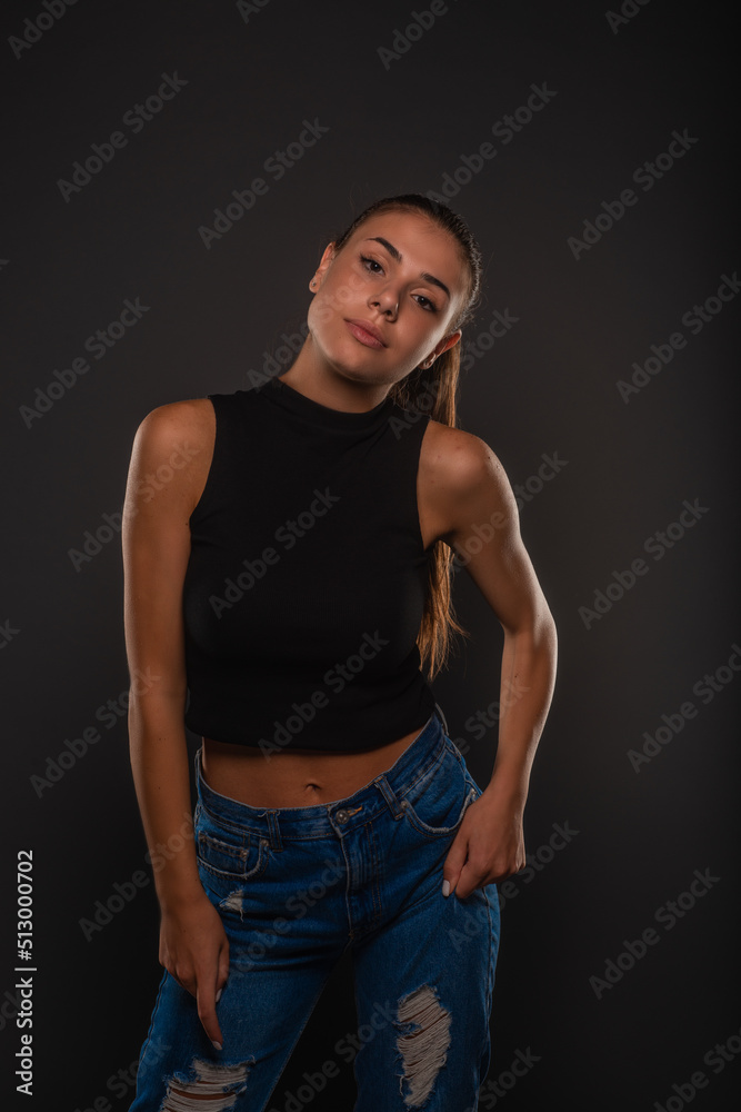 Naklejka premium Posing while holding her jeans