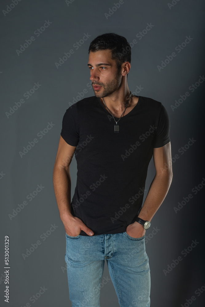 Close-up portrait of a handsome male model an with a beard wearing black shirt Close-up portrait of a handsome male model an with a beard wearing black shirt