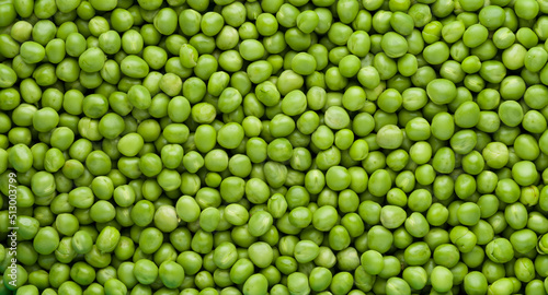 Green peas top view. Food background.  Pea pods from farmland. Pea was freshly picked. Organic fresh vegetables. healthy eating.