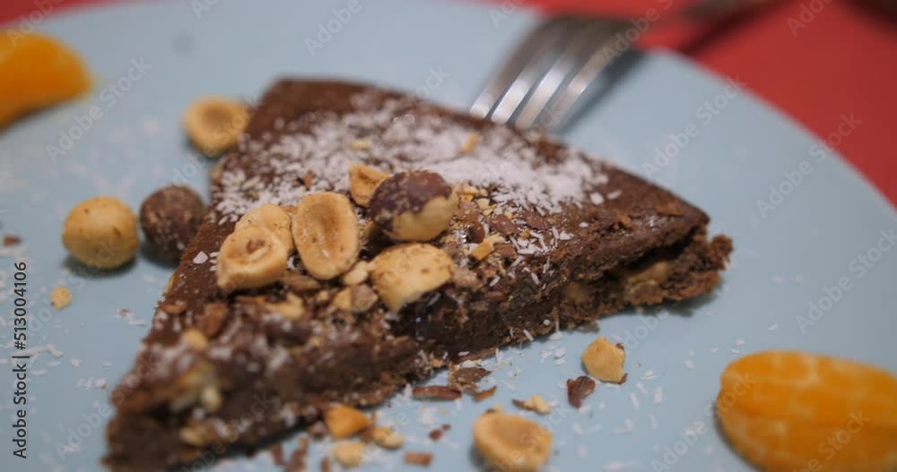 Delicious chocolate cakes on table close-up. Chocolate cheesecake with hazelnuts Delicious chocolate cakes on table close-up. Chocolate cheesecake with hazelnuts