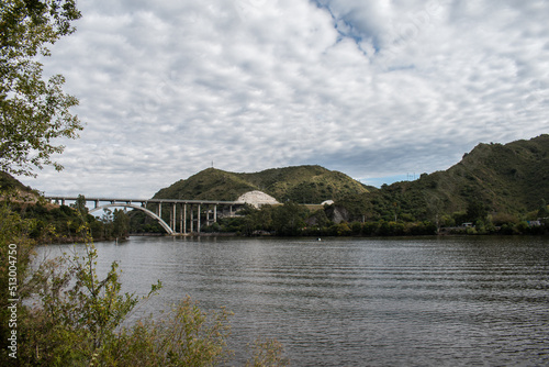 View over the San Roque Dam of Lake San Roque in Córdoba, in the background the bridge 