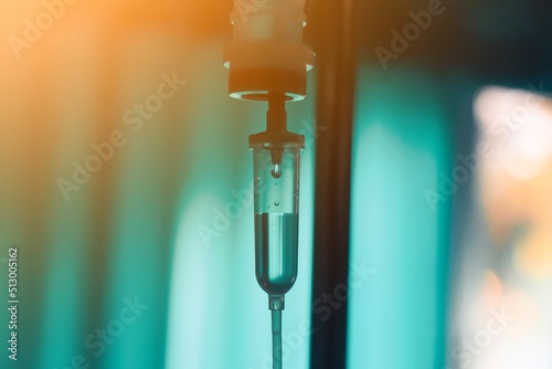 Set iv fluid intravenous drop saline drip hospital room,Medical Concept,treatment emergency and injection drug infusion care chemotherapy, concept.blue light background,selective  photo