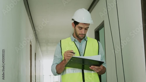 Wallpaper Mural engineer inspector check  and inspect on clipboard in building in sitework, checking worker work and inspection concept Torontodigital.ca