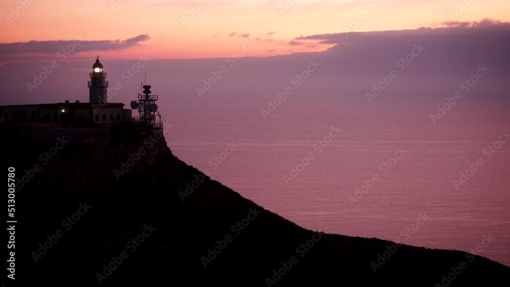 Mesa Roldan lighthouse with beacon light, early morning, Cabo de Gata Nijar Natural Park in Almeria province, Andalusia Spain. Tourist attraction, place to visit. Mesa Roldan lighthouse with beacon light, early morning, Cabo de Gata Nijar Natural Park in Almeria province, Andalusia Spain. Tourist attraction, place to visit.