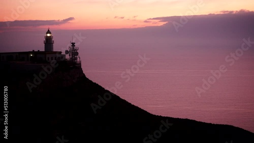 Mesa Roldan lighthouse with beacon light, early morning, Cabo de Gata Nijar Natural Park in Almeria province, Andalusia Spain. Tourist attraction, place to visit. photo