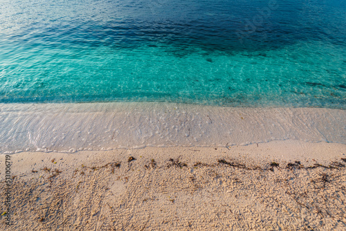 Fototapeta Naklejka Na Ścianę i Meble -  Beautiful view of the calm sea waves reaching the sandy beach in Vodice, Croatia