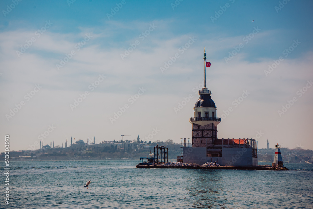 beautiful view on Maiden's Tower (Kiz Kulesi) in Istanbul with the city of Istanbul in backgrounds.