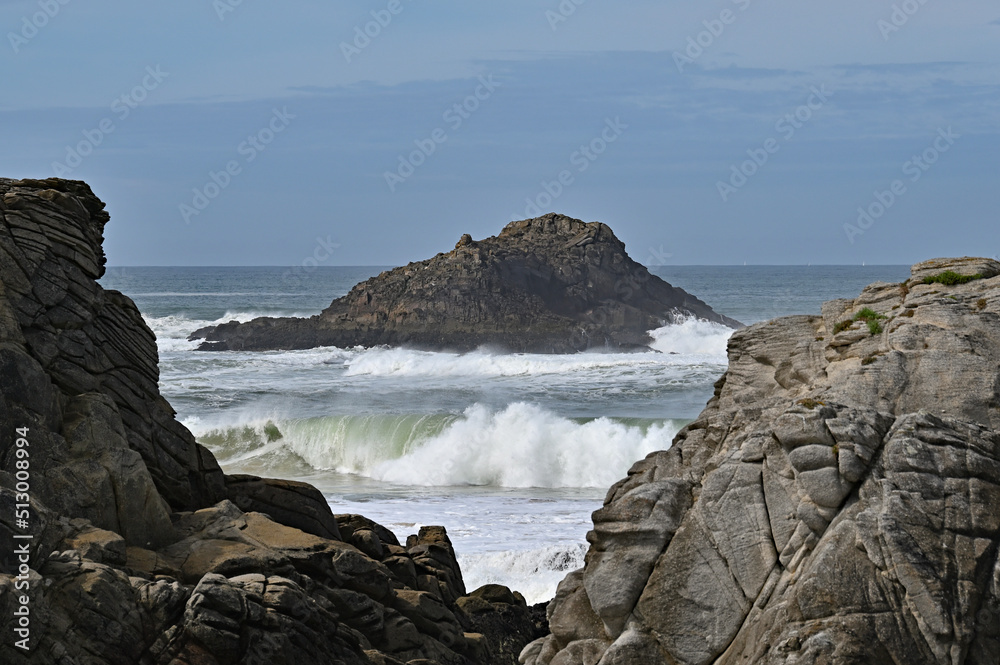 View of rocks with furious waves in the background View of rocks with furious waves in the background