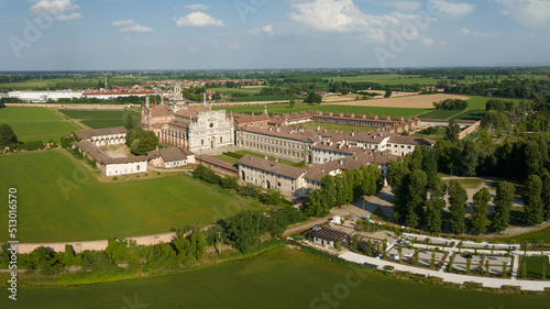 Aerial shot of the Certosa di Pavia at sunny day, built in the late fourteenth century, courts and the cloister of the monastery and shrine in the province of Pavia, Lombardia, Italy photo