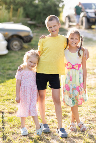 three children in the yard