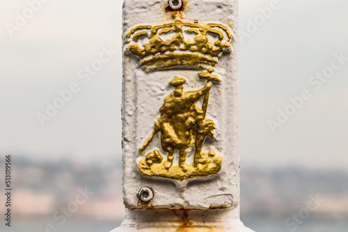 Gijón, escudo de la ciudad, en una farola de la playa de San Lorenzo, Gijón, Asturias. photo