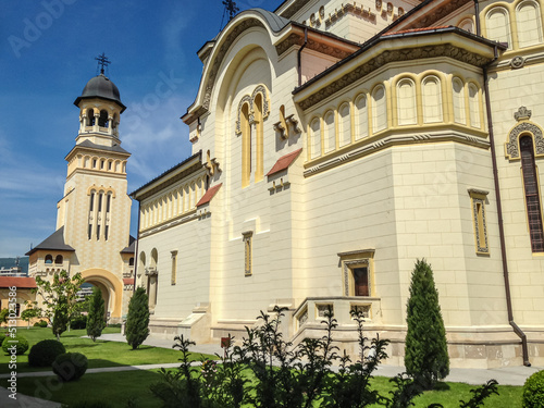 Coronation Cathedral against the blue sky in Alba Lulia, Romania photo