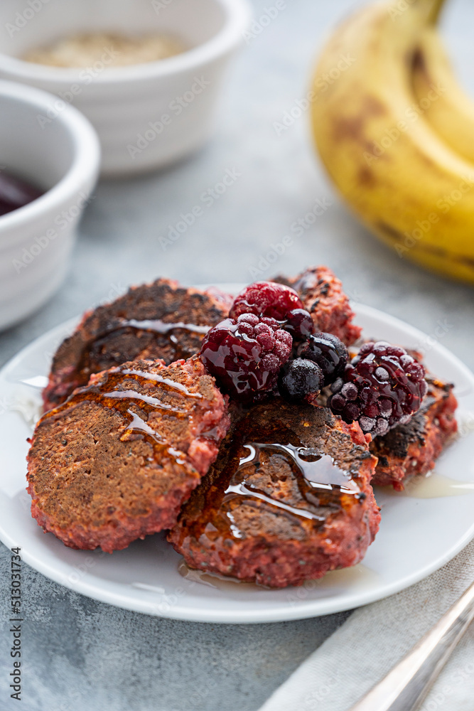 Pink pancakes made with banana, oats, an egg and berries. Healthy food. breakfast, snack for kids. Pink pancakes made with banana, oats, an egg and berries. Healthy food. breakfast, snack for kids.