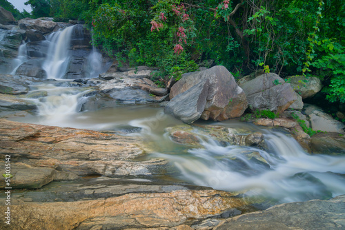 Beautiful Turga waterfall having full streams of water flowing downhill amongst stones , duriing monsoon due to rain at Ayodhya pahar (hill) - at Purulia, West Bengal, India. photo