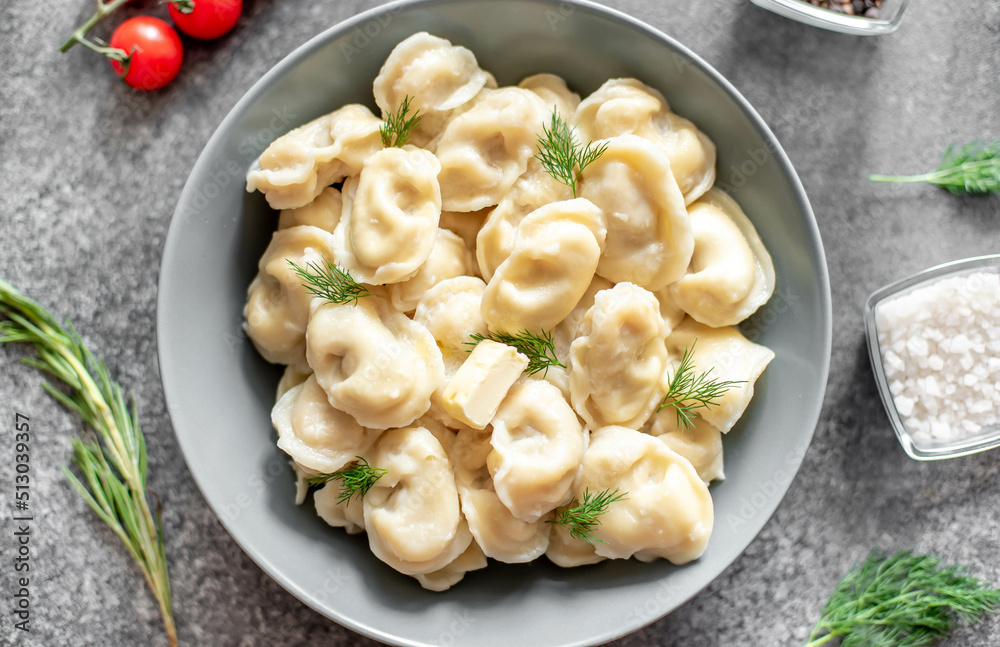 Homemade dumplings with meat - Russian dumplings. Dumplings with meat filling, ravioli on a stone background Homemade dumplings with meat - Russian dumplings. Dumplings with meat filling, ravioli on a stone background