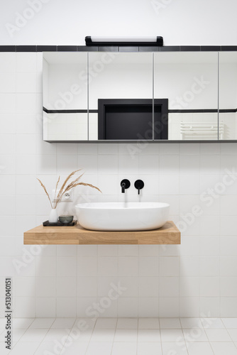 Minimalist bathroom with small, white square tiles