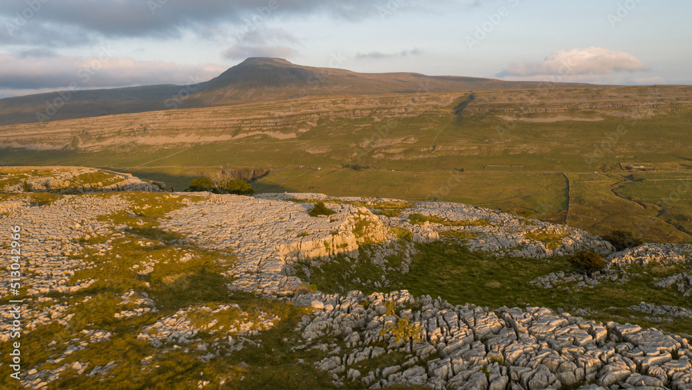 An aerial view of  the limestone pavement on Great Hard Rigg Moss on The lower slopes of Wherrnside with Ingleborough in the background