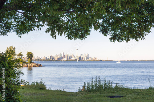 Photography View on Toronto downtown and lake Ontario from behind the trees