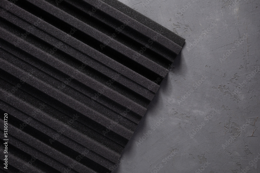 Acoustic foam material on concrete wall background texture. Foam rubber panel for record studio Acoustic foam material on concrete wall background texture. Foam rubber panel for record studio