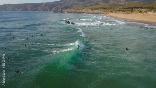 
surfer surfing a perfect wave at Guincho beach in Cascais near Lisbon, Portugal