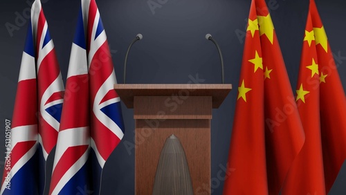 Fototapeta Naklejka Na Ścianę i Meble -  Flags of United Kingdom and China at international meeting or negotiations press conference. Podium speaker tribune with flags and coat arms. 3d rendering
