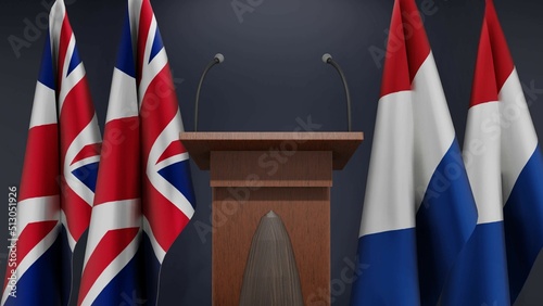 Fototapeta Naklejka Na Ścianę i Meble -  Flags of United Kingdom and Netherlands at international meeting or negotiations press conference. Podium speaker tribune with flags and coat arms. 3d rendering