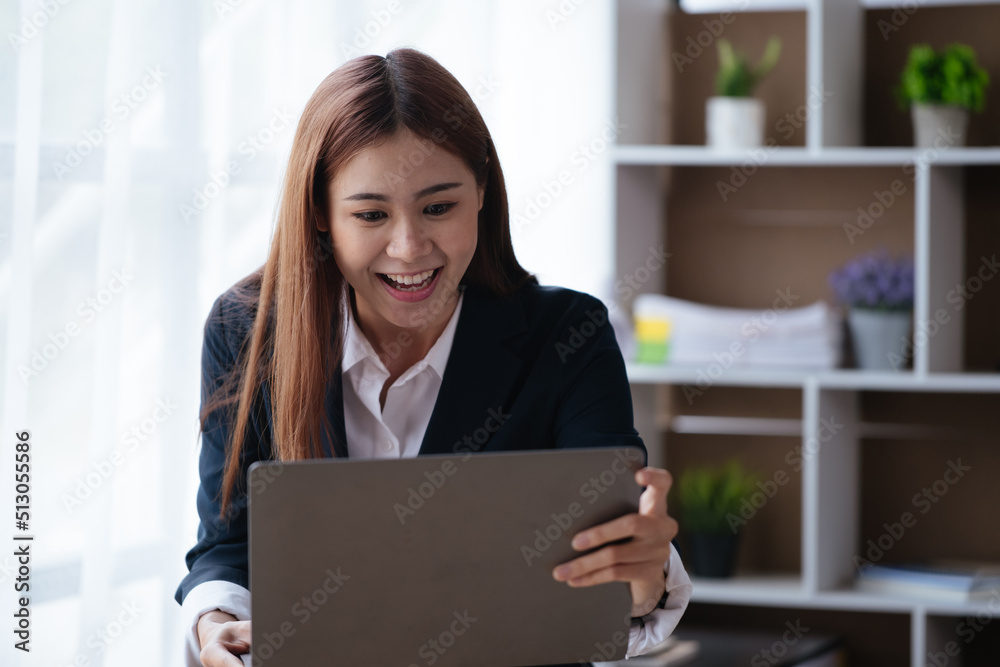 Business woman happy and cheerful for successful on project via laptop in office space. Business woman happy and cheerful for successful on project via laptop in office space.