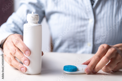 woman preparing her contact lenses  space for copy  myopia and astigmatism  vision concept  selective focus