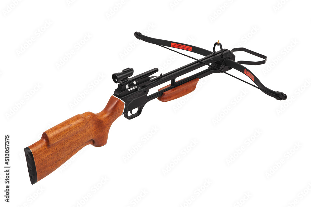 Modern crossbow with a wooden stock. Quiet weapon for hunting and sports. Isolate on a white back. Modern crossbow with a wooden stock. Quiet weapon for hunting and sports. Isolate on a white back.