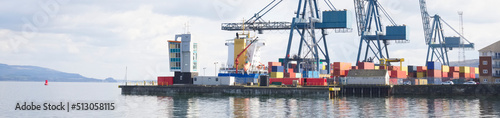 Cranes at logistics port terminal for offloading containers