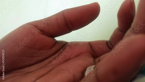 Twitchy thumb of an African woman footage. Involuntary muscle contraction and relaxation. Health issues. Benign. Black. photo