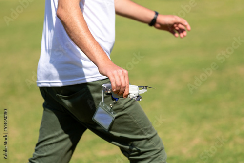 A young man flying a drone