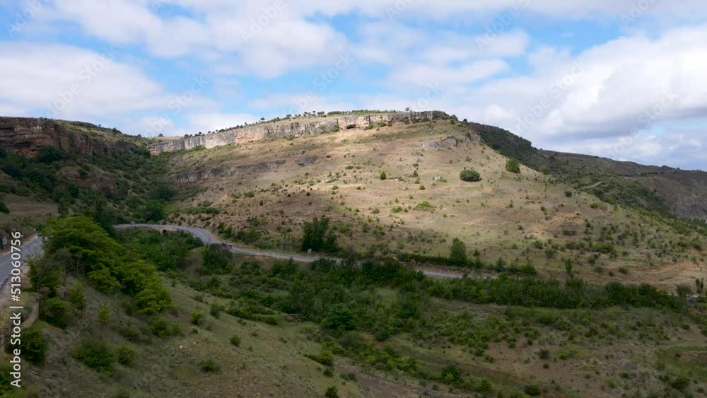 Mountain road and sheep circulating on the slopes of the mountains. Mountain road and sheep circulating on the slopes of the mountains.