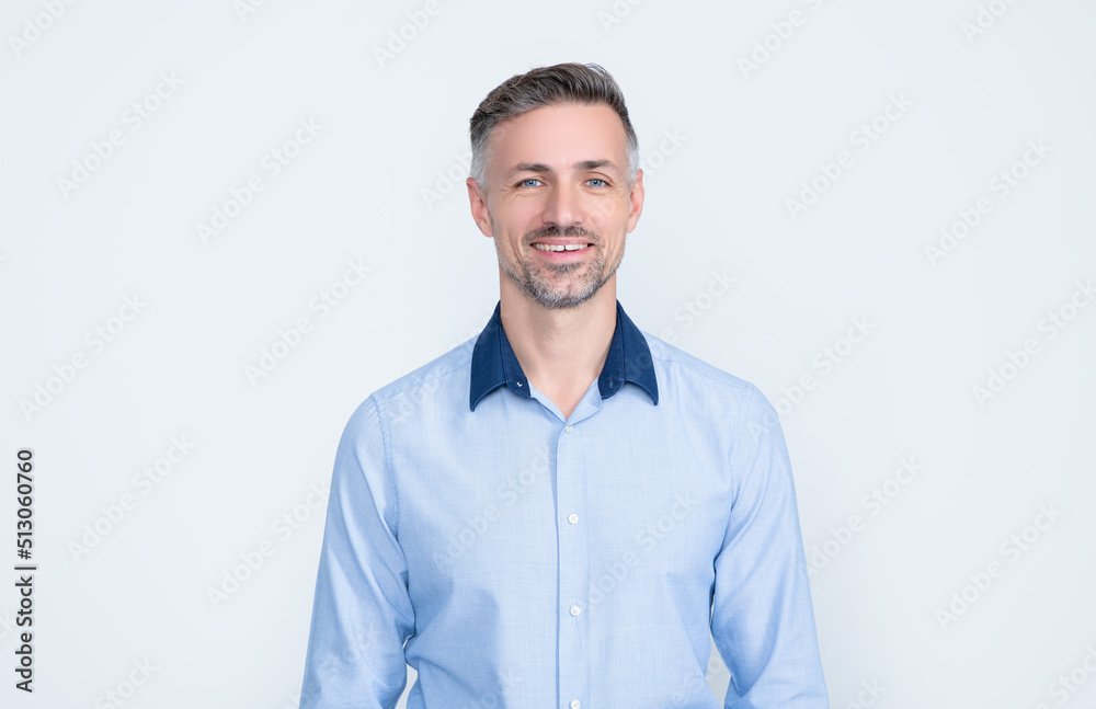 smiling mature entrepreneur in businesslike wear on grey background smiling mature entrepreneur in businesslike wear on grey background