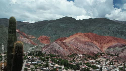 Altiplano landscape. Time lapse of the famous seven colors hill and Purmamarca village in Jujuy, Argentina. View of the colorful mountains and fast moving clouds passing by. 