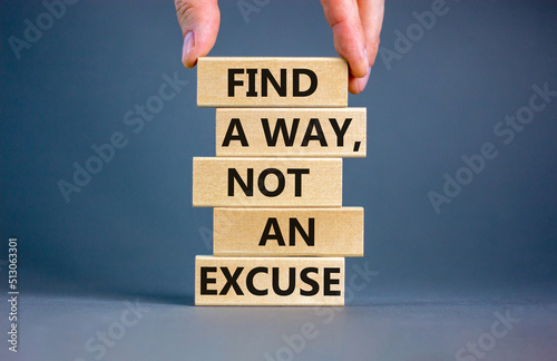 Find a way not excuse symbol. Concept words Find a way not an excuse on wooden blocks on a beautiful grey table grey background. Businessman hand. Business motivational and not excuse concept. photo