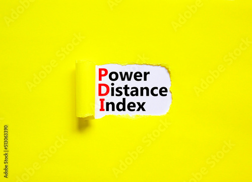 PDI power distance index symbol. Concept words PDI power distance index on white paper on a beautiful yellow background. Business PDI power distance index concept. Copy space.