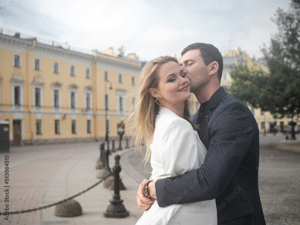happy couple, a man and a woman on a city walk. A cheerful young couple walks in the city and has a good time together, a walk in St. Petersburg