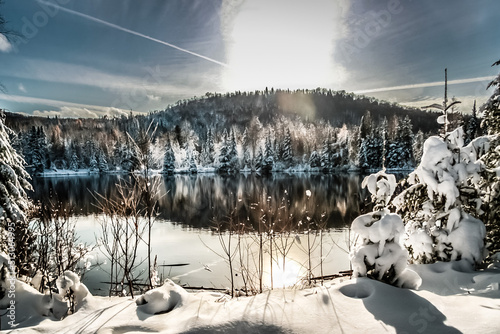 winter scene abroad a lake in rural country of Quebec, Canada