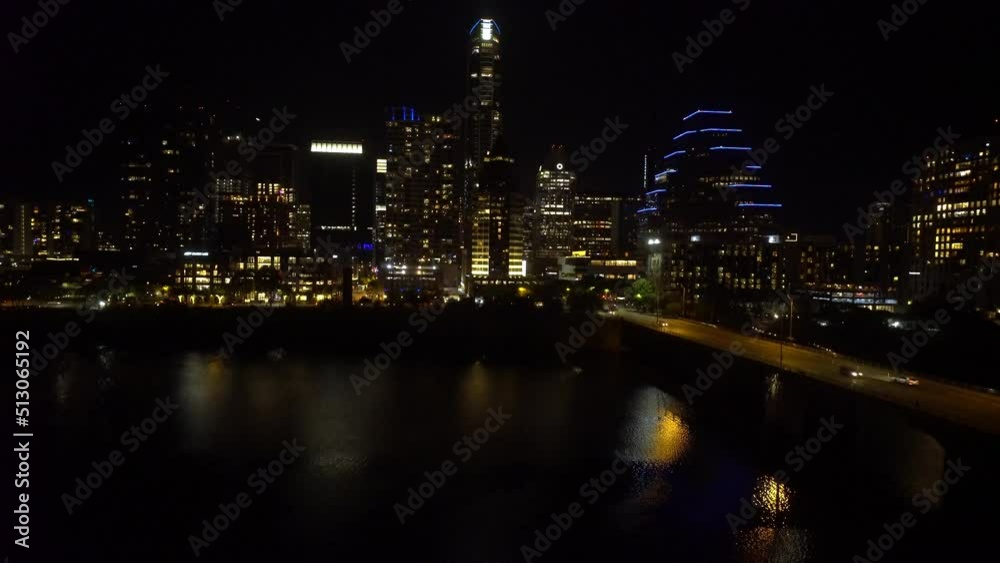 Downtown Austin Texas skyline at night with view of the Colorado river Downtown Austin Texas skyline at night with view of the Colorado river