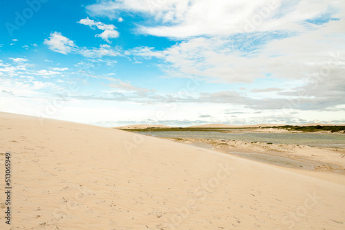 Fototapeta Naklejka Na Ścianę i Meble -  Sand dunes in Jericoacoara Ceará Brazil..Tourist and paradisiacal place with clean and beautiful skies..Vacation concept. Travel concept. Copy space.