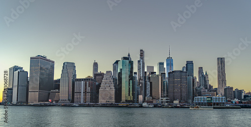A panoramic view of Manhattan city skyline at sunset