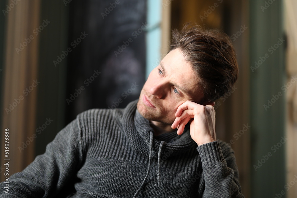 Thinking young man is brainstorming and creating new ideas and visions for his future. Thinking young man is brainstorming and creating new ideas and visions for his future.