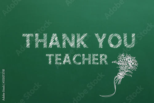 Phrase Thank You Teacher and beautiful flowers drawn on green chalkboard