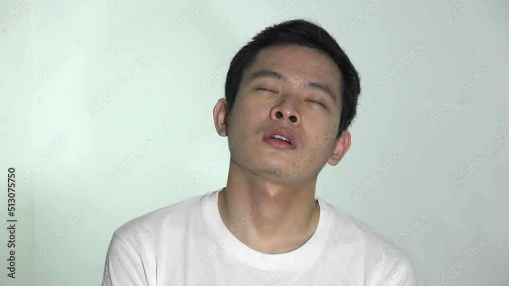 A Sleepy Tired Asian Man Isolated A Sleepy Tired Asian Man Isolated