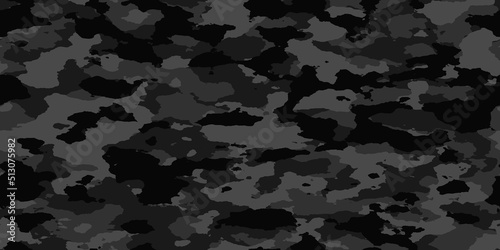 Seamless rough textured military, hunting or paintball camouflage pattern in a dark black and grey night palette. Tileable abstract contemporary classic camo fashion textile surface design texture..