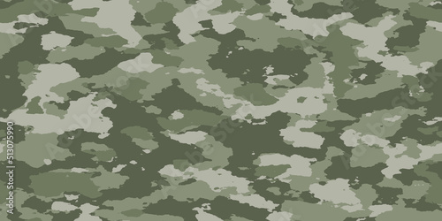 Seamless rough textured military, hunting, paintball camouflage pattern in a light forest sage green khaki palette. Tileable abstract contemporary classic camo fashion textile surface design texture.