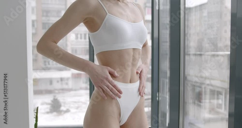 Closeup cropped of unrecognizable fit woman wearing lingerie