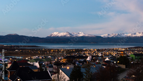 Obraz na płótnie Sunset over the Beagle Channel with the buildings of Ushuaia and the snowy mountain range. Argentina w salonie
